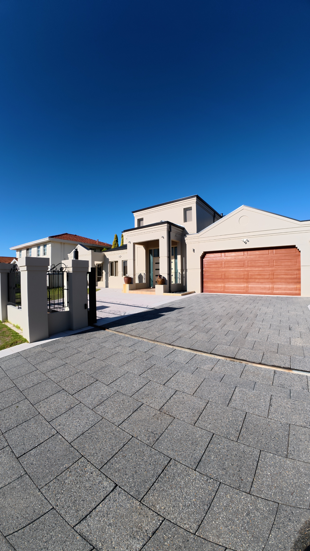 Pristine paved driveway after professional pressure cleaning